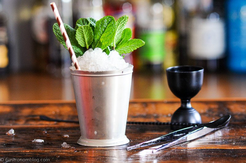Chocolate Mint Julep in silver cup with mint sprig and striped paper straw