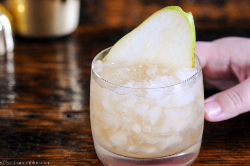 Pear Cocktail in glass with crushed ice, pear slice