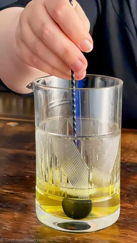 Yellow cocktail in mixing glass