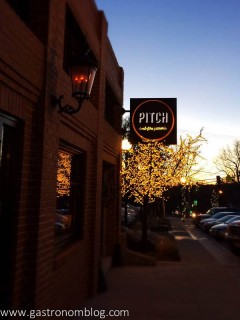 Outside of Pitch Pizzeria with sign