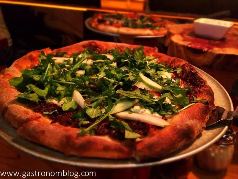 Pizza covered with arugula