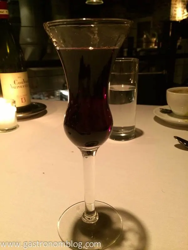 Dark cocktail in curvy glass