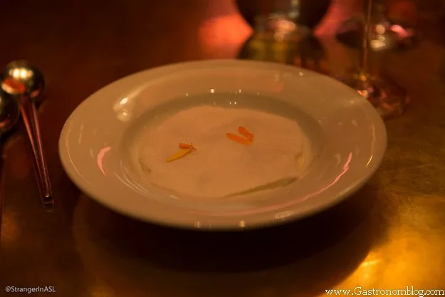 white cotton candy wafer on top of soup in white bowl at Jose Andres Las Vegas
