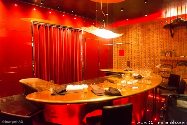 Inside of e by Jose Andres, golds and red curtains everywhere