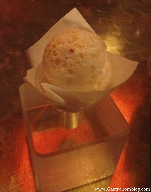 cheese ball served in paper cone at e by Jose Andres