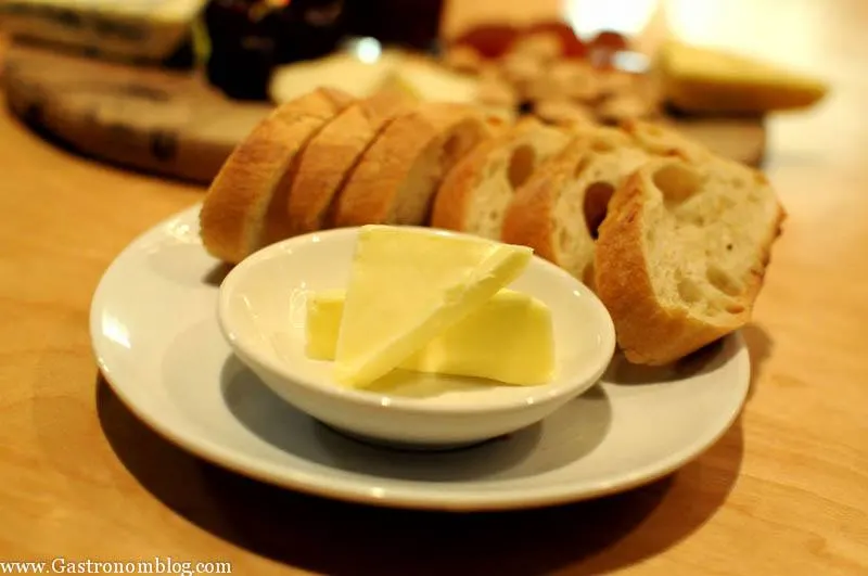 Bread plate with butter in ramekin