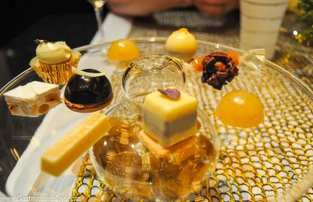 Petit fours and small desserts on glass plate at Robuchon Las Vegas