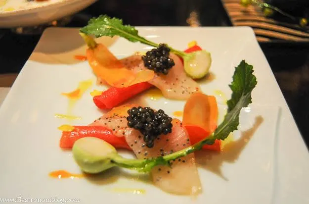 Caviar and vegetables on white square plate