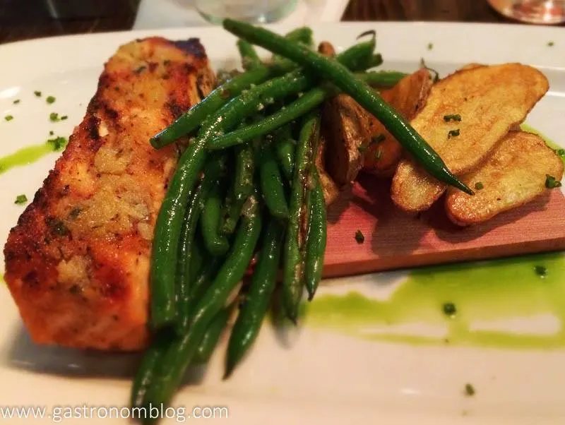 Salmon and green beans on white plate
