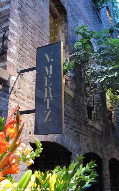 V Mertz Restaurant Omaha sign on brick wall in Omaha Old Market Passageway