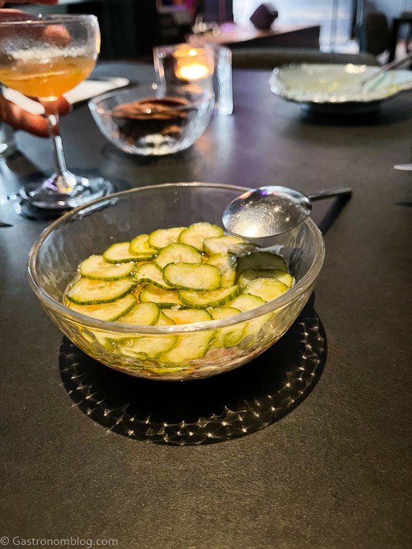 glass bowl with steak tartare topped with pickles at Corvino Supper Club