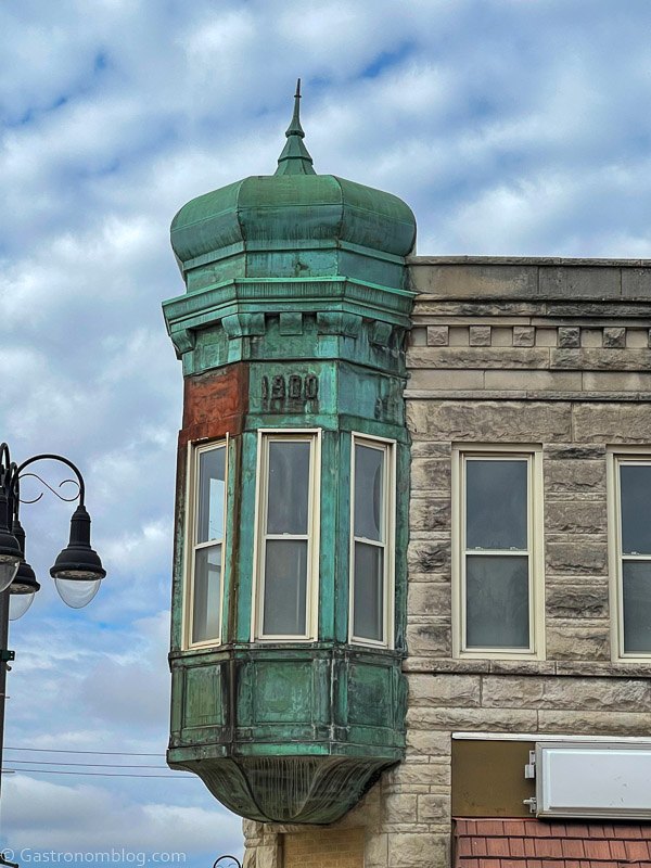 Green Cupula or turret on tan block building in Grinnell, Iowa