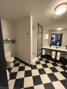 Bathroom in Penthouse suite at Hotel Grinnell, black and white check floor
