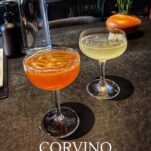 Orange cocktail and yellow cocktail in coupes at Corvino Supper Club