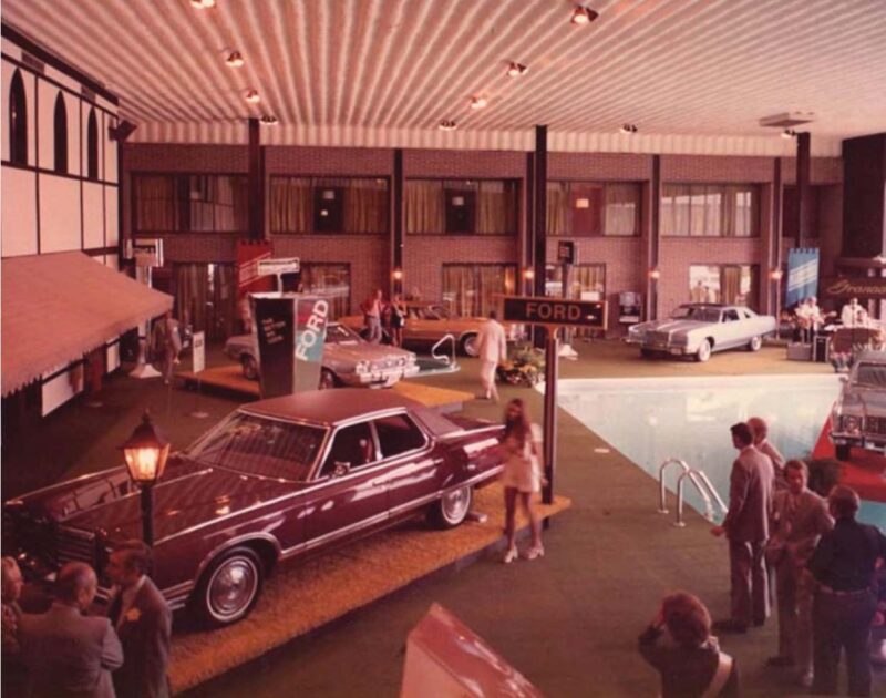 Vintage picture from the Highlander Hotel Iowa City of a car show by the pool