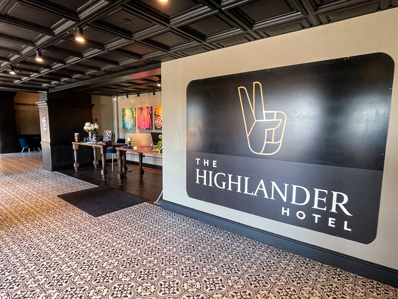 Highlander Hotel Iowa City logo sign - peace sign