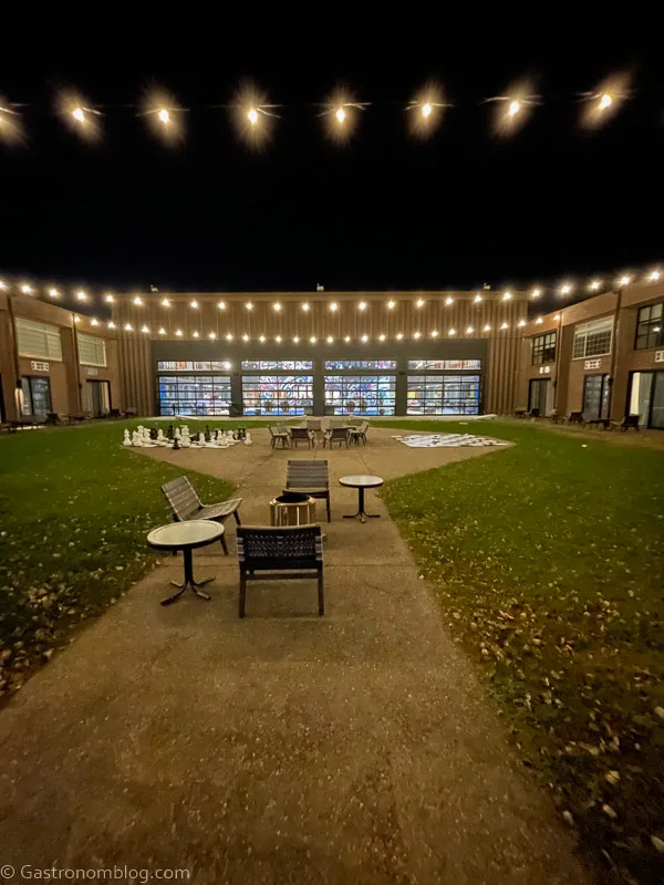 courtyard with firepits and chairs at The Highlander Hotel Iowa City