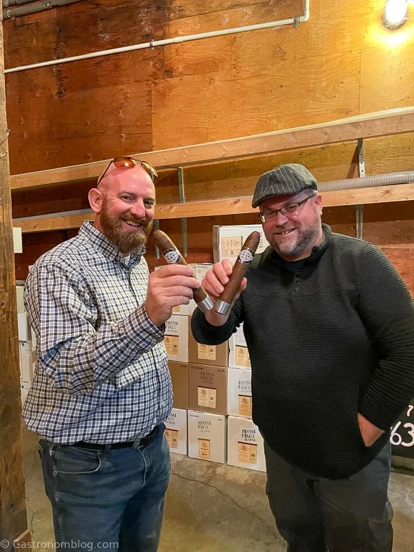 2 men holidng cigars at a Napa Valley Wine Tasting