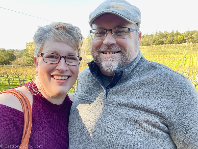 Man and Woman smiling for camera while wine tasting at Sonoma vineyards