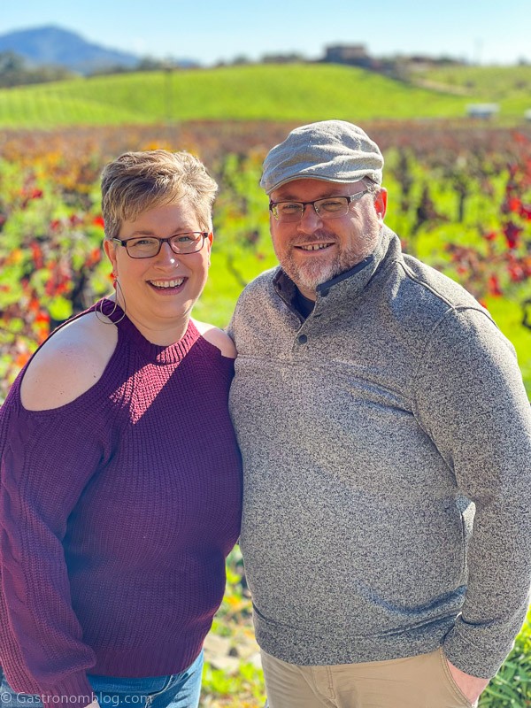man and woman in front of vineyards in Sonoma Valley