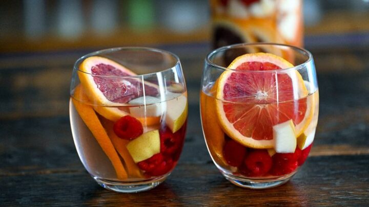 Blood orange sangria with blood orange slices in wine glasses