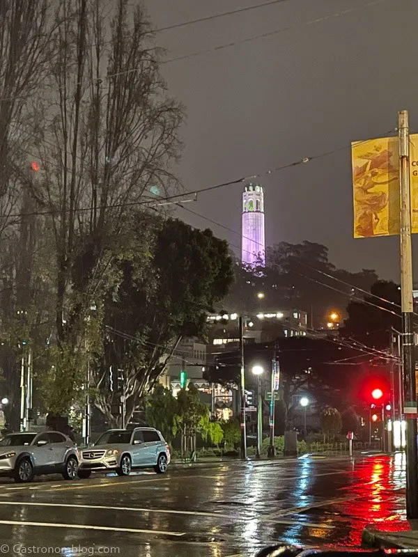 Coit tower lit up at night in San Francisco