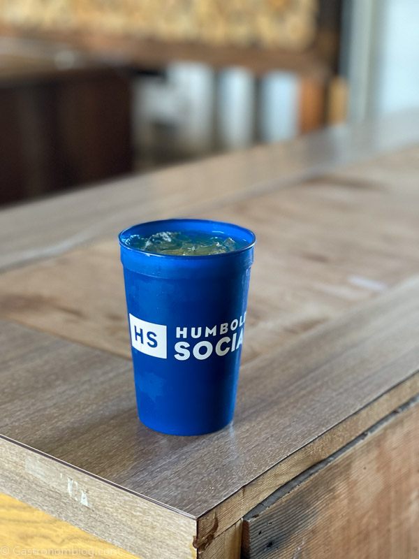 Cocktail in plastic blue cup at Humboldt Bay Social Club