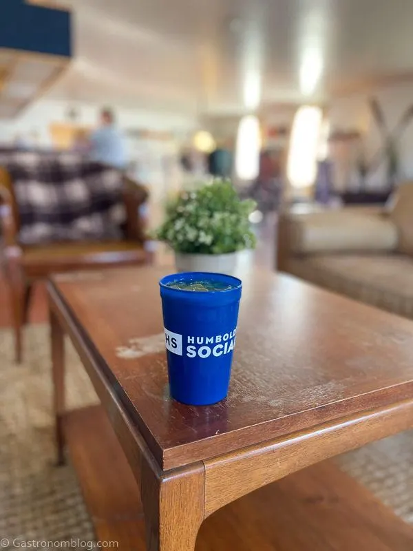 cocktail in blue plastic cup in the Lobby Bar at Humboldt Bay Social Club