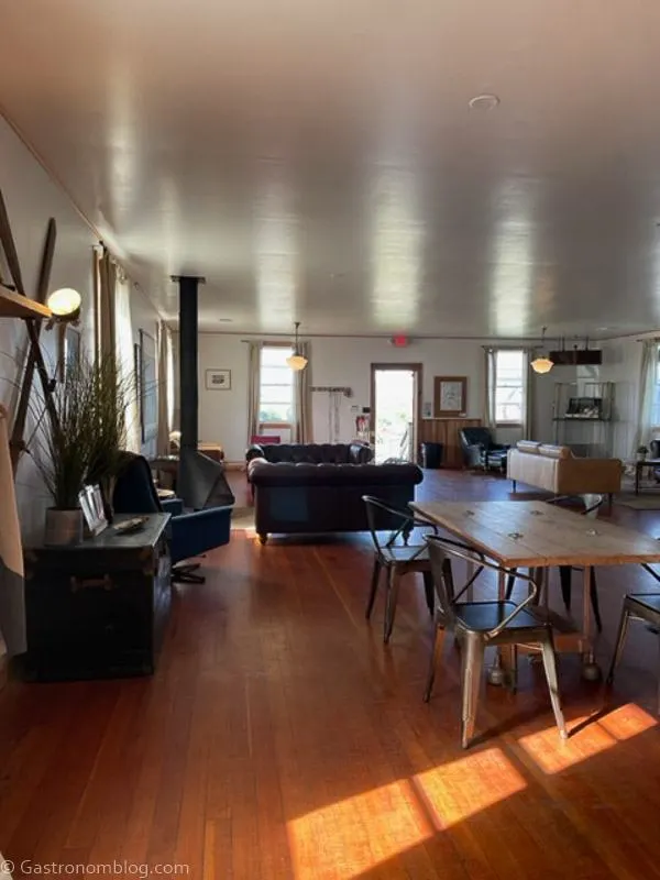Inside of Humboldt Bay Social Club Lobby Bar, vintage tables and chairs, stove
