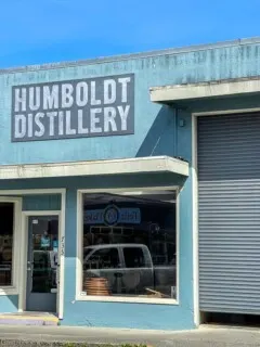 Outside of Humboldt Distillery, a blue building