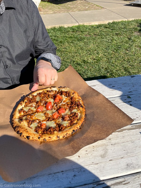 Pizza on parchment on a picnic table in Napa valley