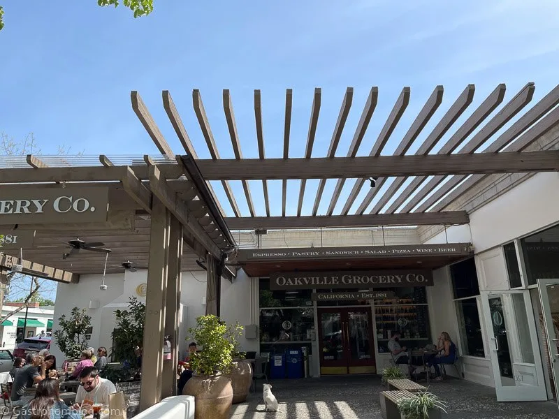 Outside of Oakville Grocery Healdsburg, pergola over front entrance and over patio