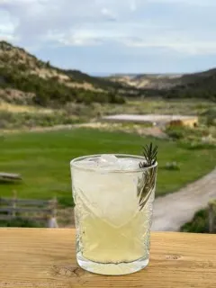cocktail with rosemary garnish at Boulder Mountain Guest Ranch and Sweetwater Kitchen