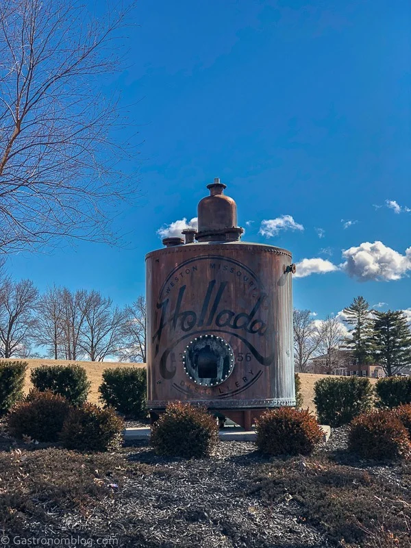 Still with Holladay Distilling sign on outside