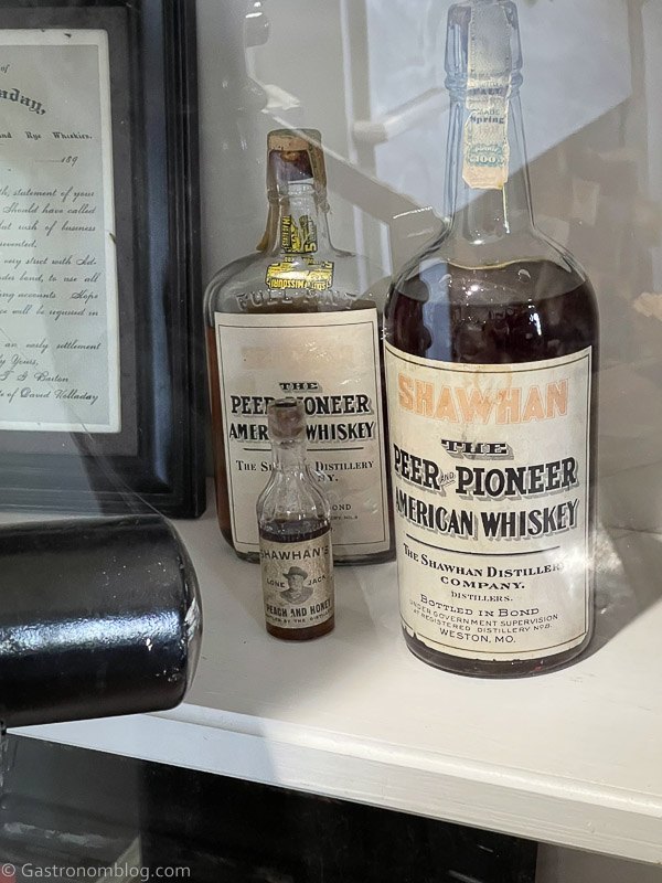 historic whiskey bottles at Hollday Distillery