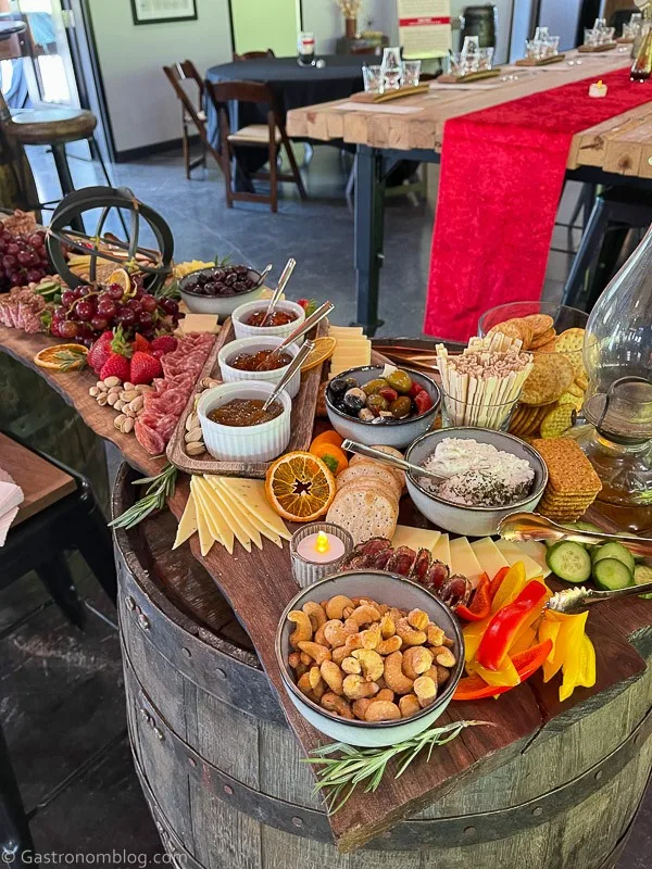 Charcuterie board with various foods on it