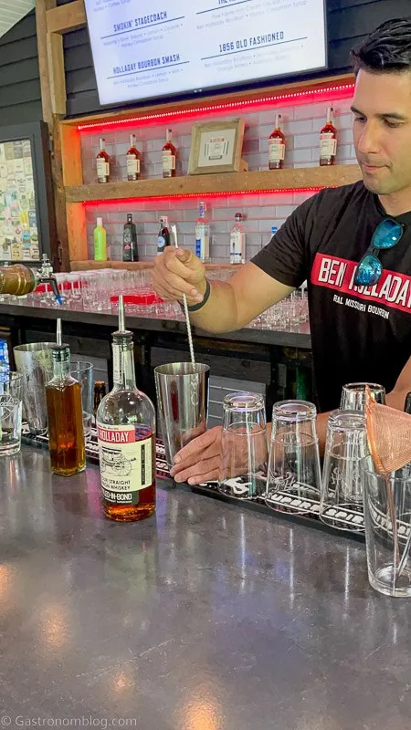 Bartender mixing whiskey cocktails at Holladay Distilling