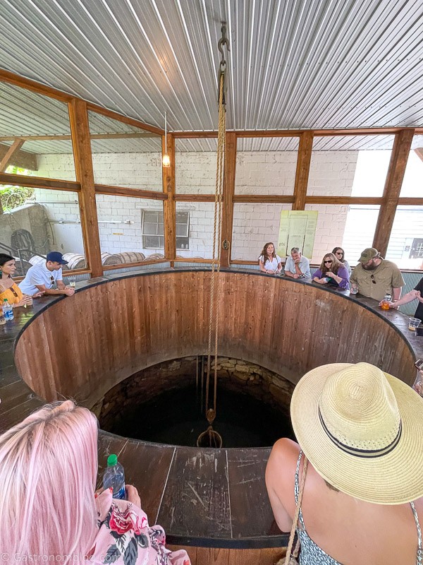 Well at Holladay Distillery, people standing around it