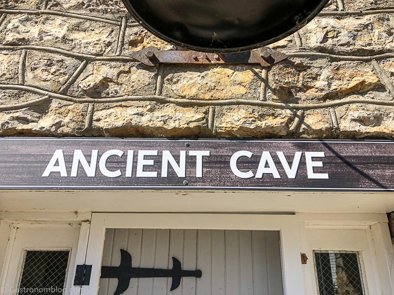 Ancient Cave sign above door at Holladay Distilling
