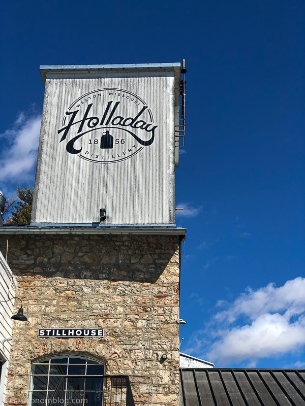 Sign on limestone building at Holladay Distilling