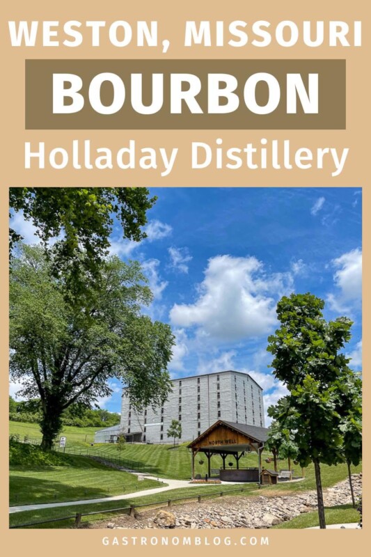 Rcikhouse and green grass under blue sky at Holladay Distillery!