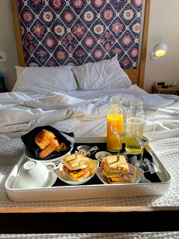 Brunch tray of food at Hotel Alma Minneapolis on bed