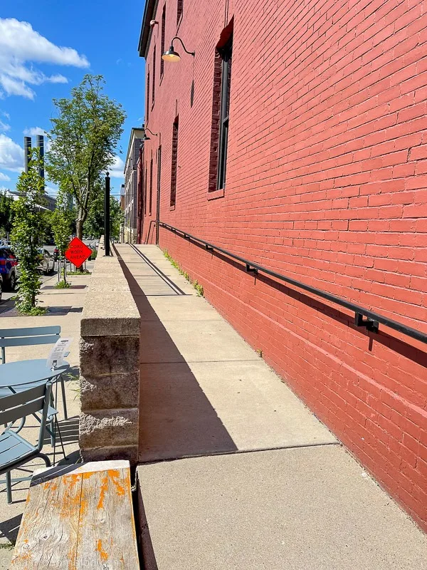 Outside ramp to side door at brick building Hotel Alma Minneapolis