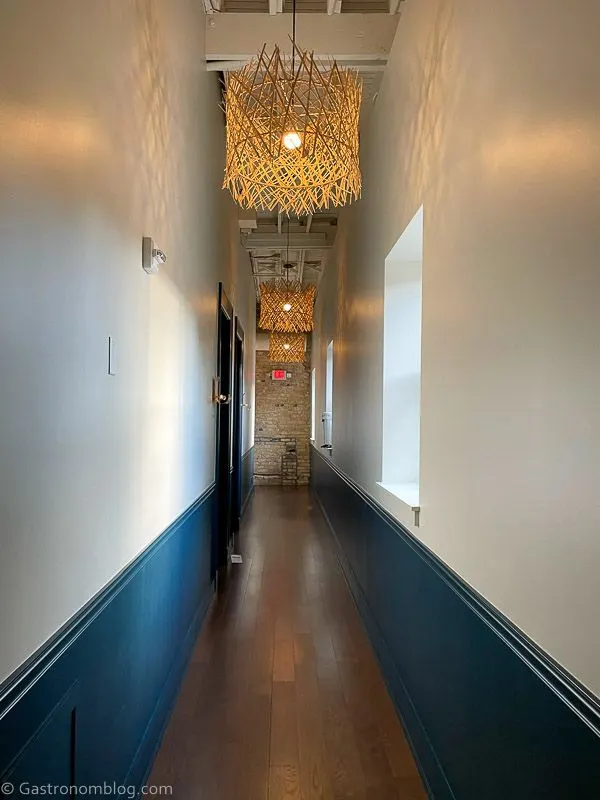 Hallway with white walls at Hotel Alma Minneapolis