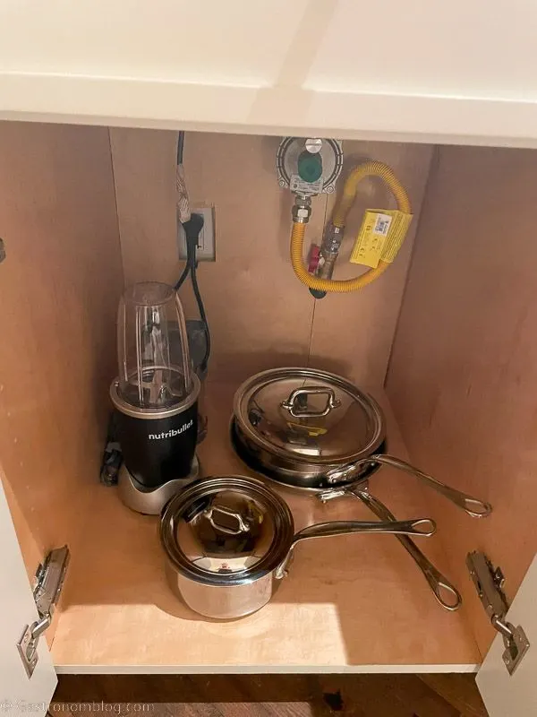 cooking pots in cupboard