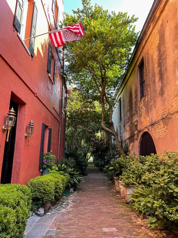 alleyway with red buildings in Charleston, South Carolina