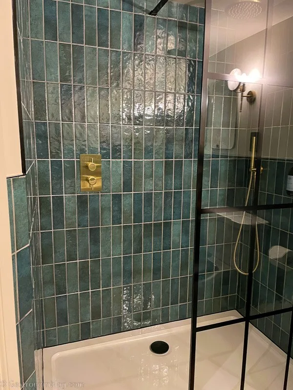 green tiled shower in bathroom at Killiecrankie House