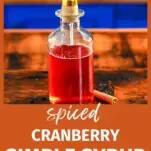 Red Spiced Cranberry Simple Syrup in gold topped bottle