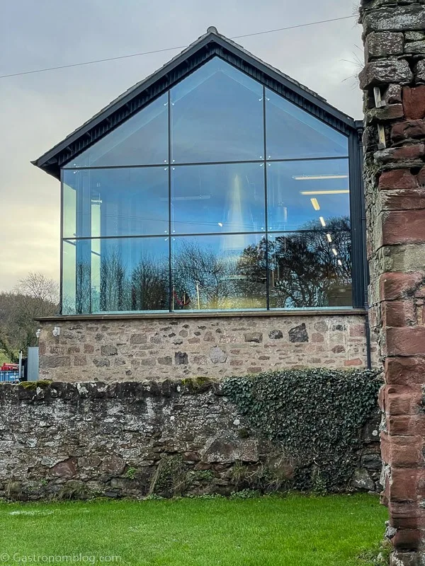 outside glass wall at Lindores Abbey Distillery