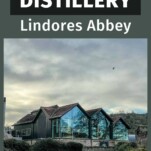 view of the outside of Lindores Abbey Distillery, glass walls